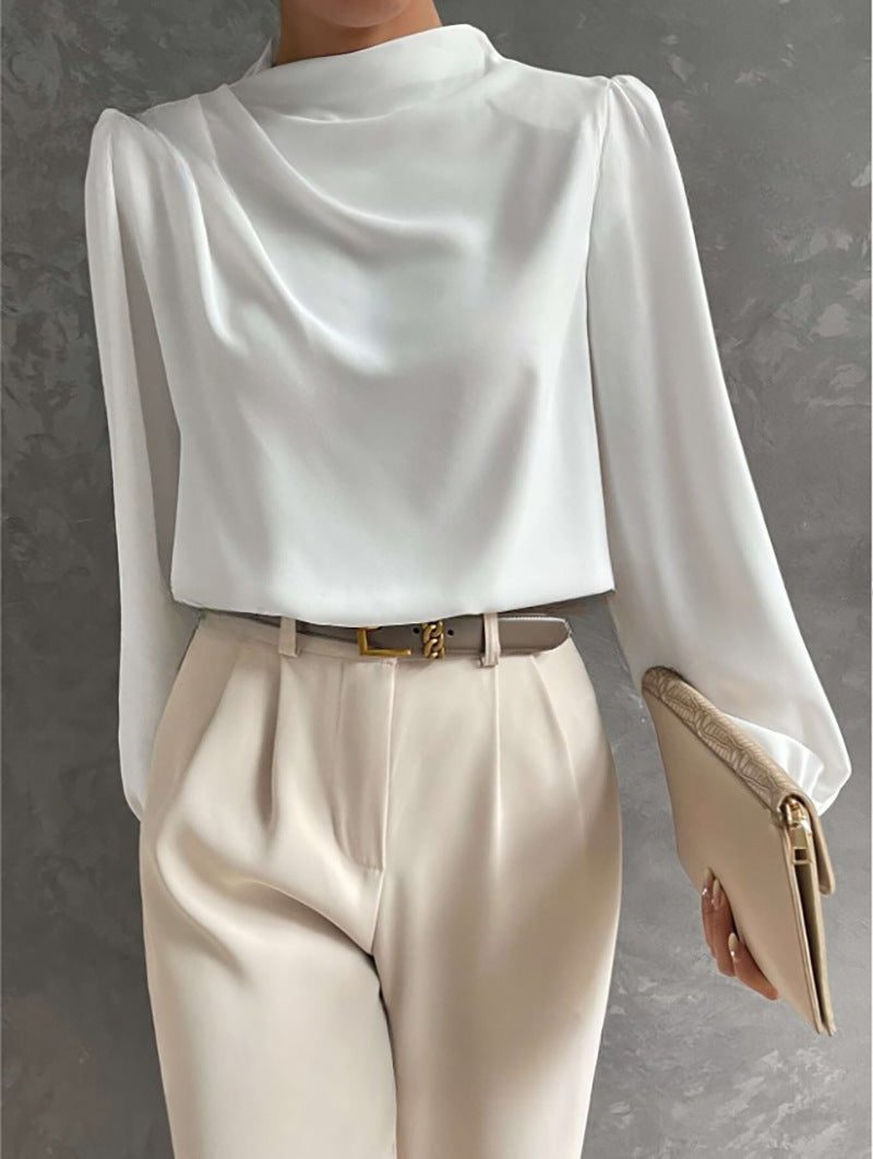 Woman wearing a high-neck long sleeve blouse
